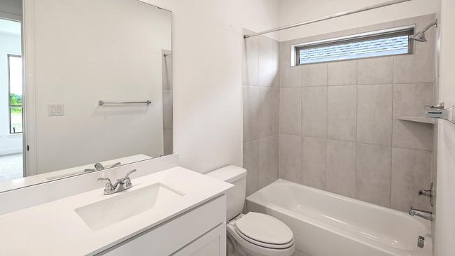 Bathroom featuring bathing tub / shower combination and vanity | Image 19