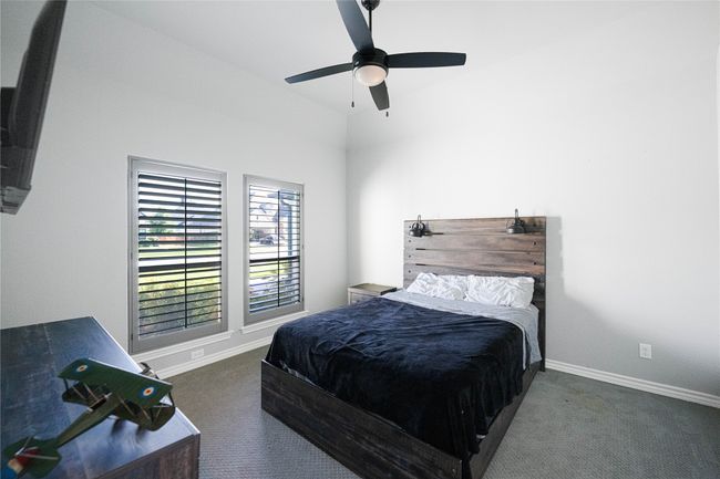 Bedroom with carpet, baseboards, and ceiling fan | Image 17