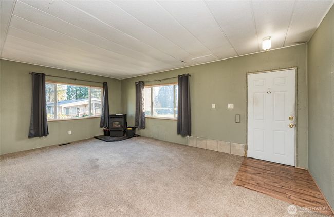 living area with pellet stove | Image 5