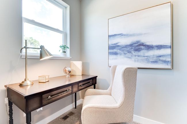 Tucked off the very far end of the main level, this pocket-style office offers the perfect setting for a homework spot or office locale for those working from home! Photo of model home, color and options will vary. | Image 11