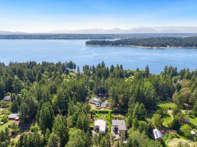 From the aerial view, note the proximity to the water - with the peninsula and the Olympic Mountains beyond. | Image 36