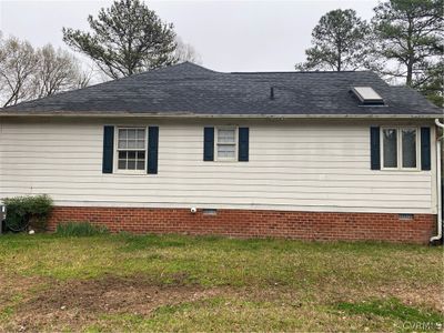 View of property exterior featuring a lawn | Image 3