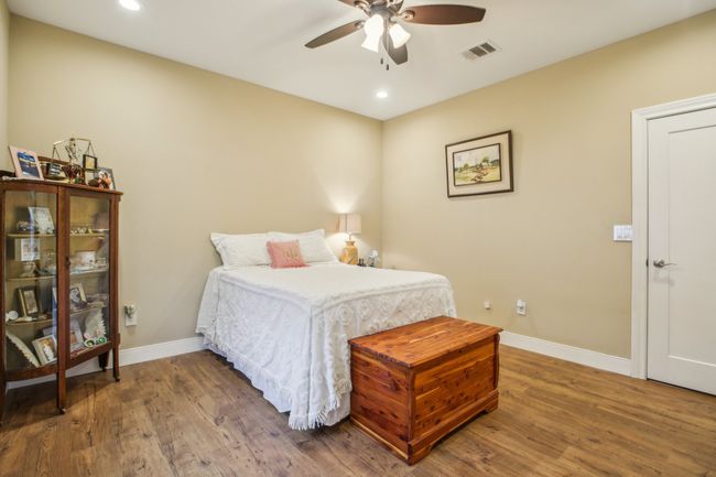 Bedroom with ceiling fan and hardwood / wood-style floors | Image 20