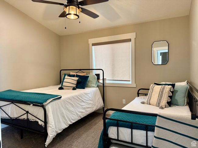 Bedroom with carpet floors and ceiling fan | Image 32