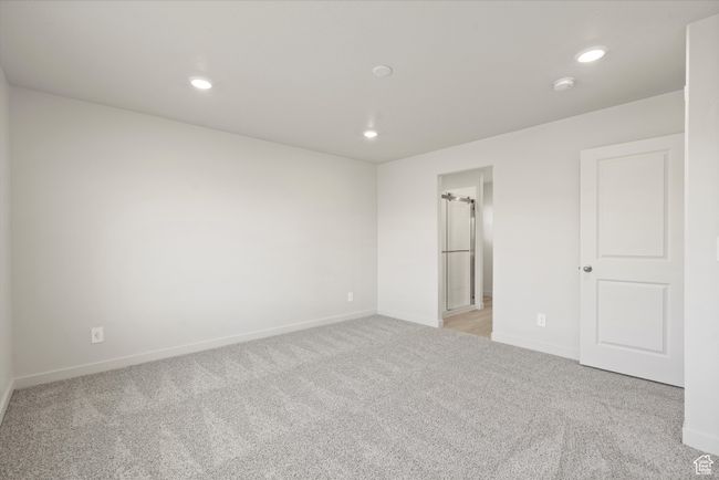 Unfurnished bedroom with light colored carpet and recessed lighting | Image 31