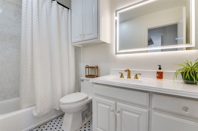 Full bathroom with shower / tub combo, toilet, and vanity | Image 13