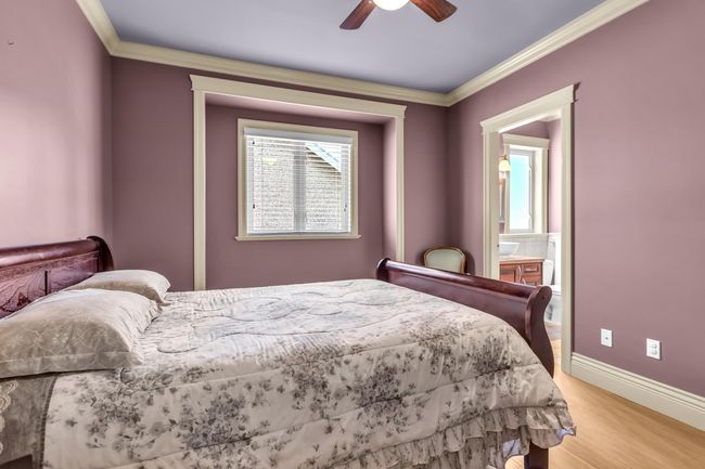 Bedroom featuring light wood-style flooring, ornamental molding, baseboards, and a ceiling fan | Image 23