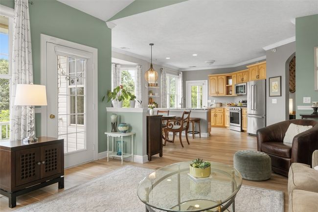 The open flow between the main living area and kitchen is the perfect layout. | Image 11