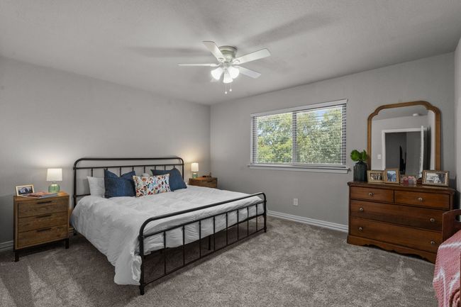 UpstairsBedroom #4 and a ceiling fan | Image 28