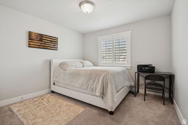 Carpeted bedroom with baseboards | Image 24