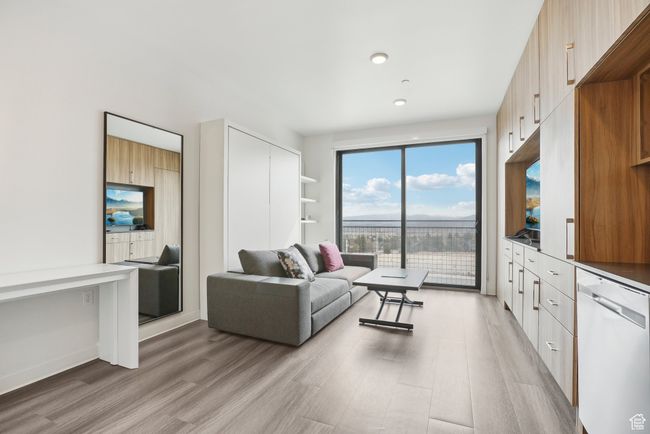 Living area featuring light wood-style flooring | Image 4