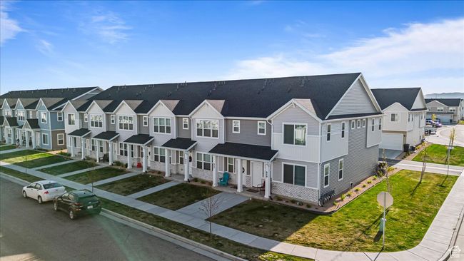 View of front of property featuring a residential view and a front yard | Image 27