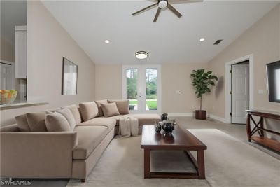 Living room featuring french doors, lofted ceiling, and ceiling fan | Image 3