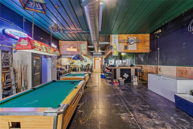 Recreation room with billiards and wooden walls | Image 11