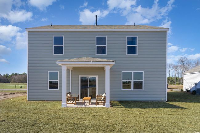 Rear view of house featuring a yard and a patio area | Image 28