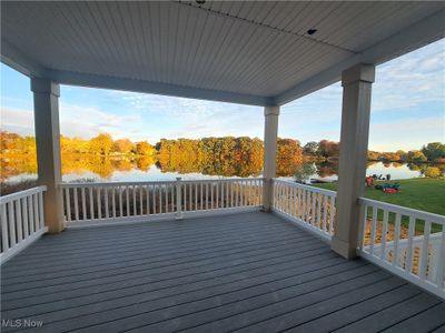 Wooden terrace featuring a water view | Image 3