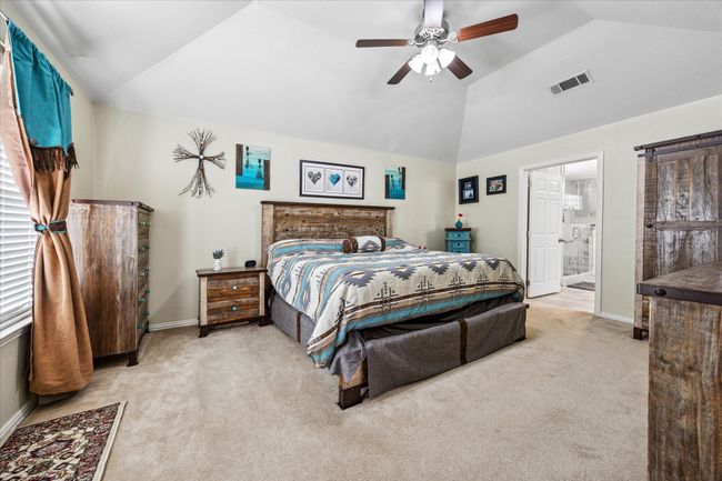 Bright master bedroom with large windows, an ensuite bath, and a generous walk-in closet for added comfort and convenience. | Image 14