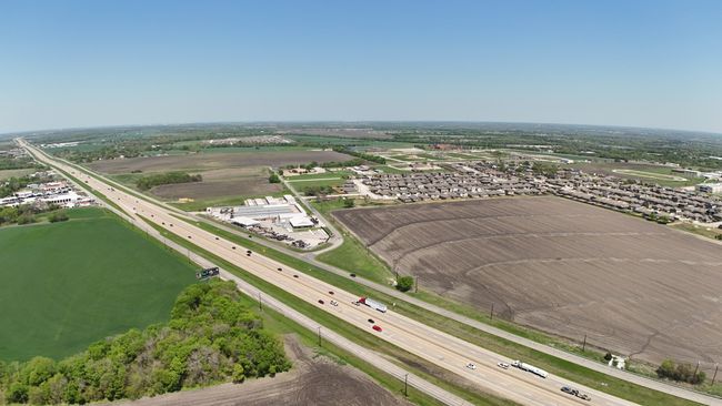 View looking Northeast. New construction all around the property. Hwy 75 frontage. | Image 16