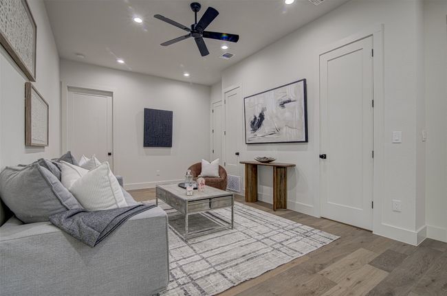 Living area with wood finished floors, recessed lighting, ceiling fan, and baseboards | Image 20
