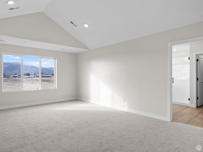 Unfurnished room featuring visible vents, baseboards, a mountain view, and light colored carpet | Image 21