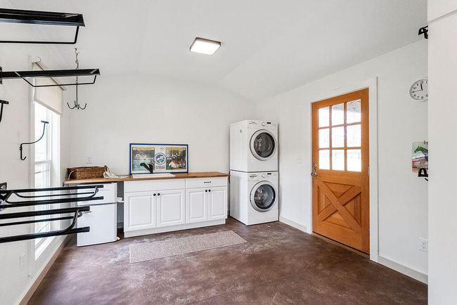 Washer/Dryer & Magic Chef mini fridge, deep sink and cabinetry make up the efficiency amenities. | Image 72