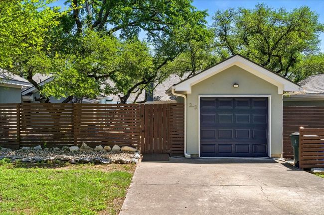 Garage with fence and driveway | Image 40