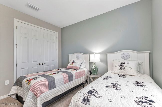 Bedroom with visible vents, baseboards, a closet, and carpet flooring | Image 30