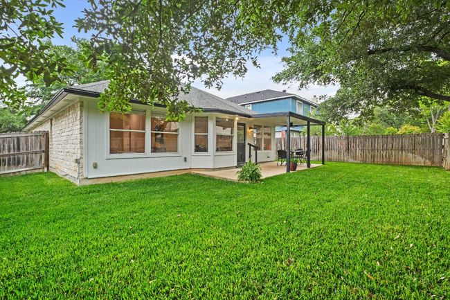 The backyard is a blank canvas for your outdoor design, with room for landscaping and recreation. 9349 Bernoulli Dr., Austin, TX 78748 | Image 32