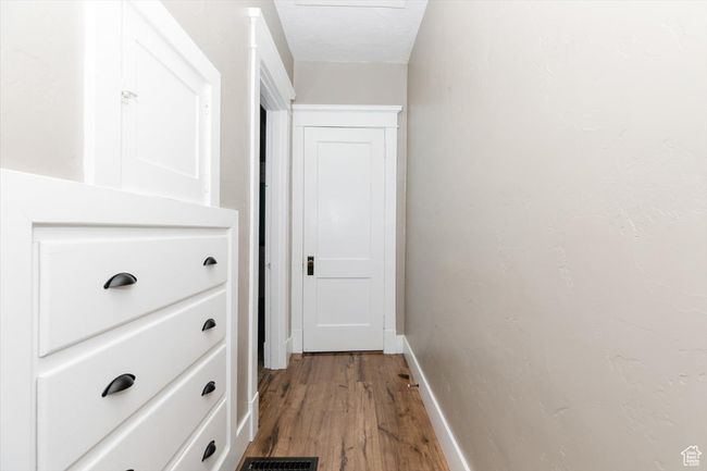 Below grade area with washer / dryer and baseboards | Image 23