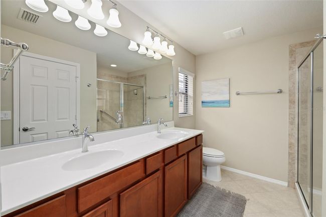 Spacious primary suite offers comfort, privacy, and a peaceful retreat. | Image 12
