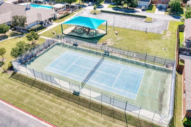Bird's eye view of a pool, tennis court and kids' playing area | Image 40