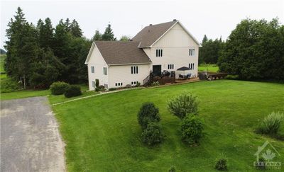 This approx. 5200 sq.ft. multi-family home features three separate homes in one, making it perfect for extended families who want to live together while maintaining their own private spaces. | Image 1