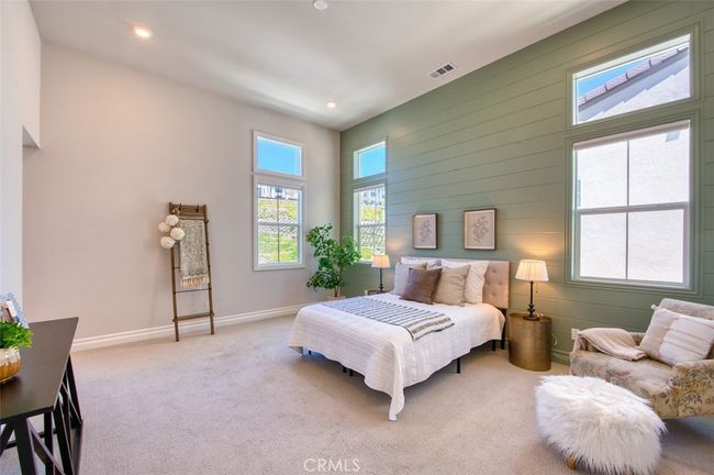 Bright and spacious primary bedroom with high ceilings, shiplap accents and en-suite bathroom. | Image 14