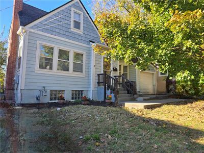 View of front facade featuring a garage | Image 1