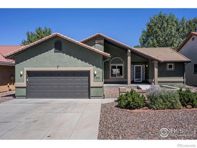 Newly painted stucco home with Spanish tile roof (just 5 years old); xeriscaped front yard; fully maintained | Image 1