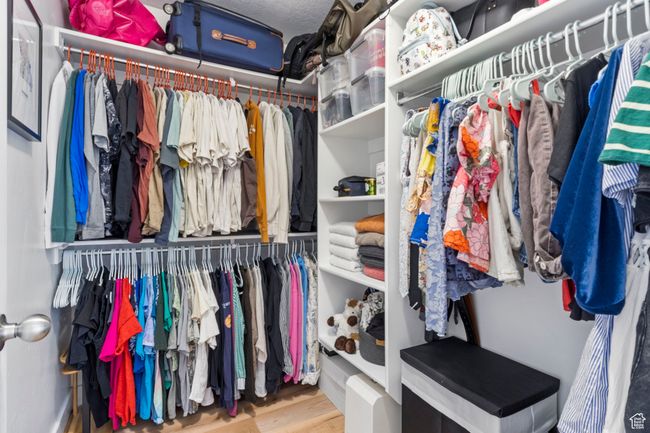 Spacious closet featuring wood finished floors | Image 19