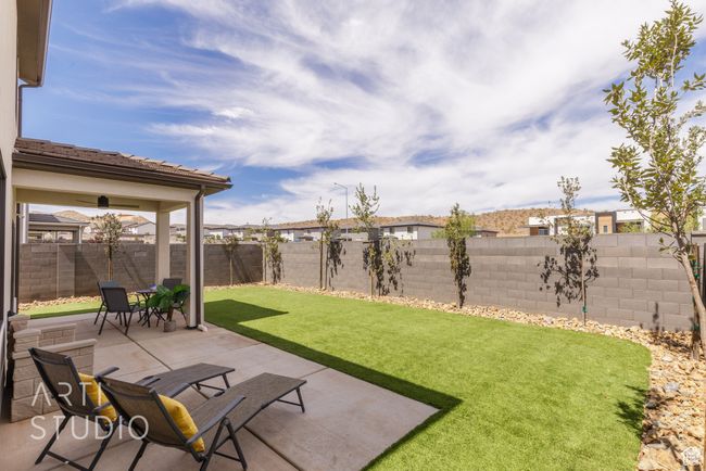 View of yard with a patio and a fenced backyard | Image 4