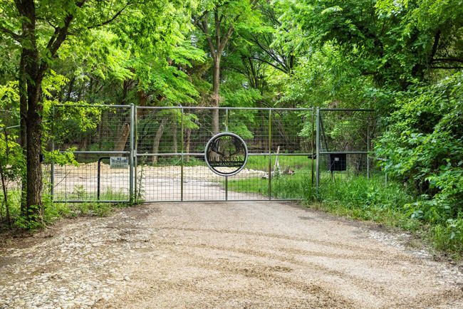 View of gate featuring fence | Image 13