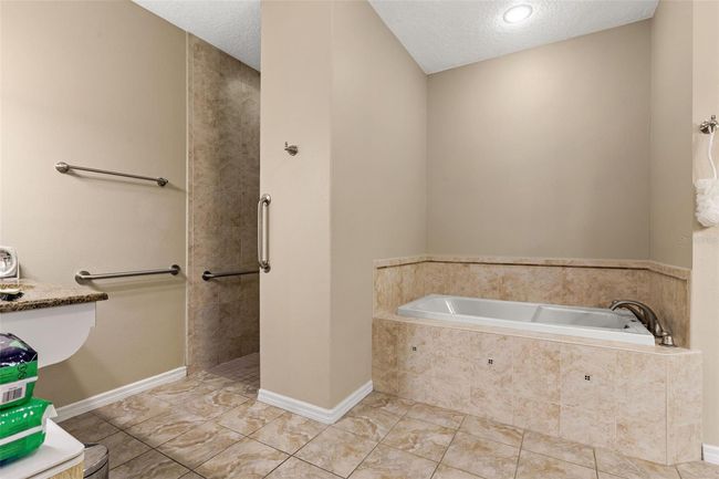 Primary Bathroom with dual vanities, garden tub and walk in shower | Image 29