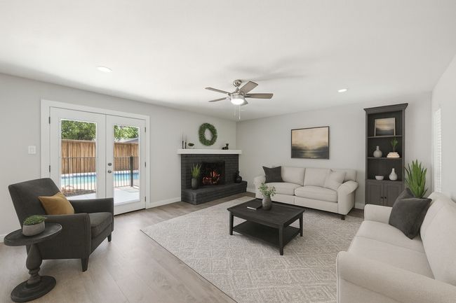Virtual Staging for this Family Room that looks out to the pool, providing one of the many options for decorating! | Image 18