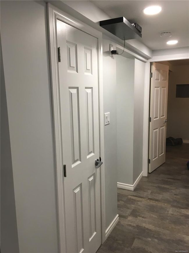 Hall with dark wood-style flooring, baseboards, and recessed lighting | Image 31