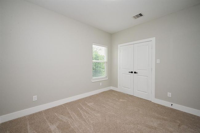 Another Secondary Bedroom With Double Closet Doors | Image 13