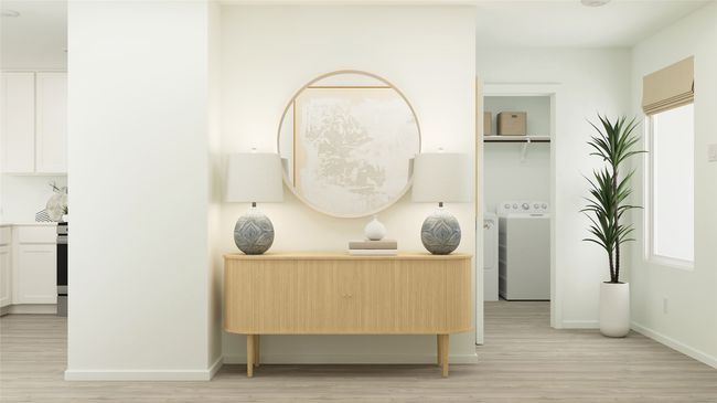Detailed view of washer / clothes dryer and wood finished floors | Image 24