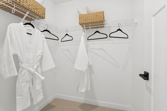 (Photo of a decorated model, actual homes finishes will vary) The primary bedroom features a walk-in closet. | Image 16