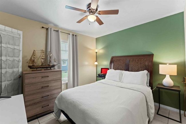 Versatile secondary bedroom—perfect as a guest room, home office, or cozy space for the kids | Image 18
