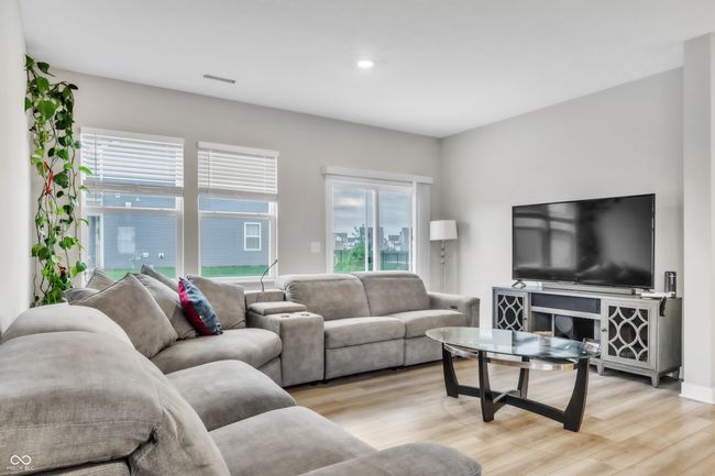 living room with visible vents, recessed lighting, and light wood-style floors | Image 9