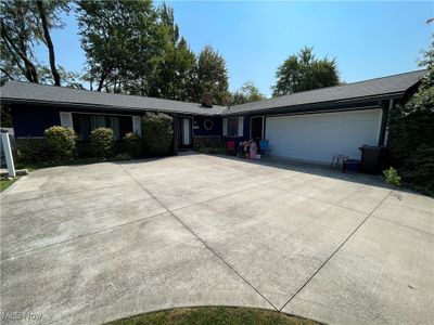 Single story home featuring a garage | Image 1