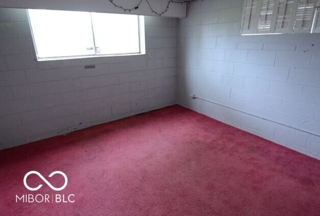 4th BR in basement featuring carpet floors and plenty of natural light from full sized window. | Image 36