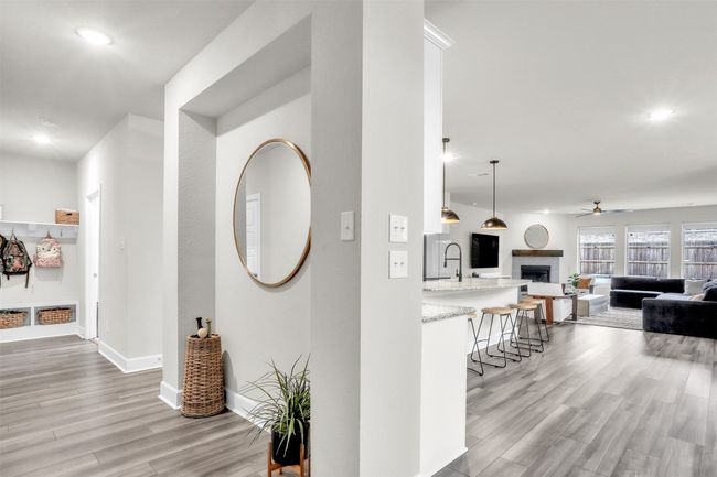 Hallway with light wood-style flooring, recessed lighting, and baseboards | Image 13