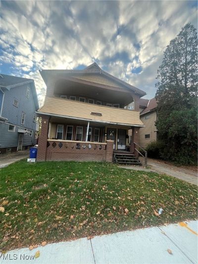 View of front of home featuring covered porch and a front lawn | Image 2